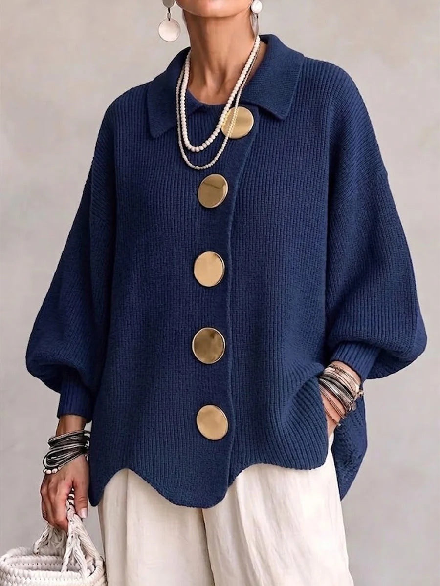 Loose-fitting solid color collared knit sweater with metal buttons and an irregular hem