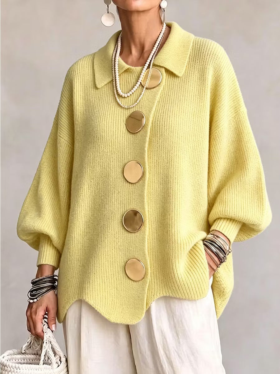 Loose-fitting solid color collared knit sweater with metal buttons and an irregular hem