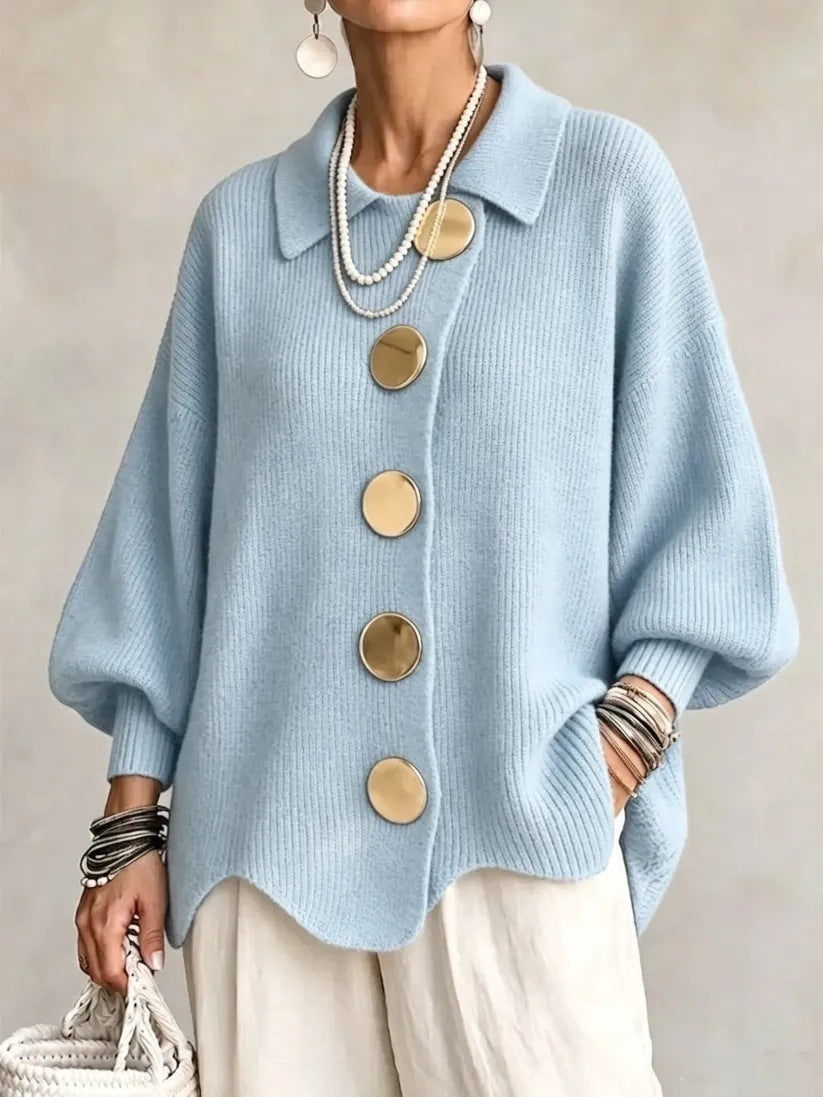 Loose-fitting solid color collared knit sweater with metal buttons and an irregular hem