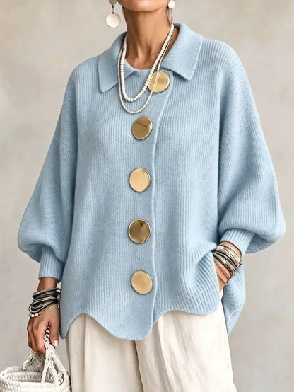 Loose-fitting solid color collared knit sweater with metal buttons and an irregular hem
