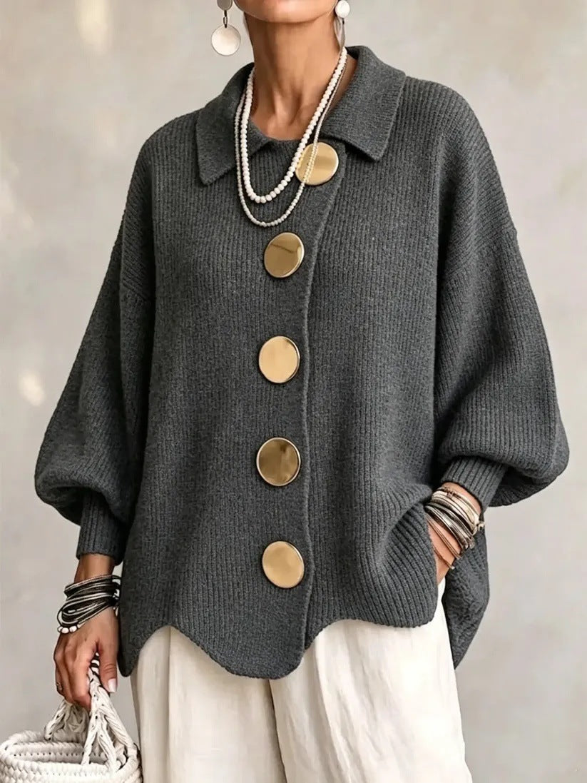 Loose-fitting solid color collared knit sweater with metal buttons and an irregular hem