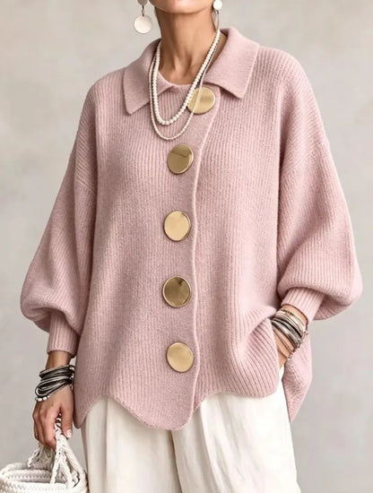 Loose-fitting solid color collared knit sweater with metal buttons and an irregular hem