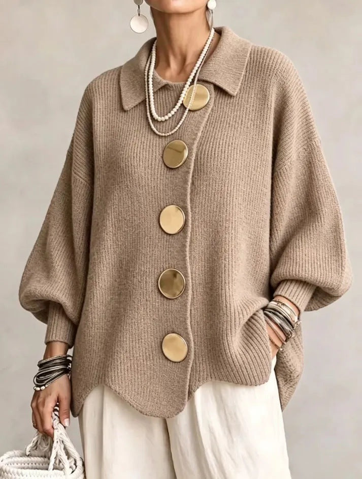 Loose-fitting solid color collared knit sweater with metal buttons and an irregular hem
