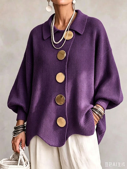 Loose-fitting solid color collared knit sweater with metal buttons and an irregular hem
